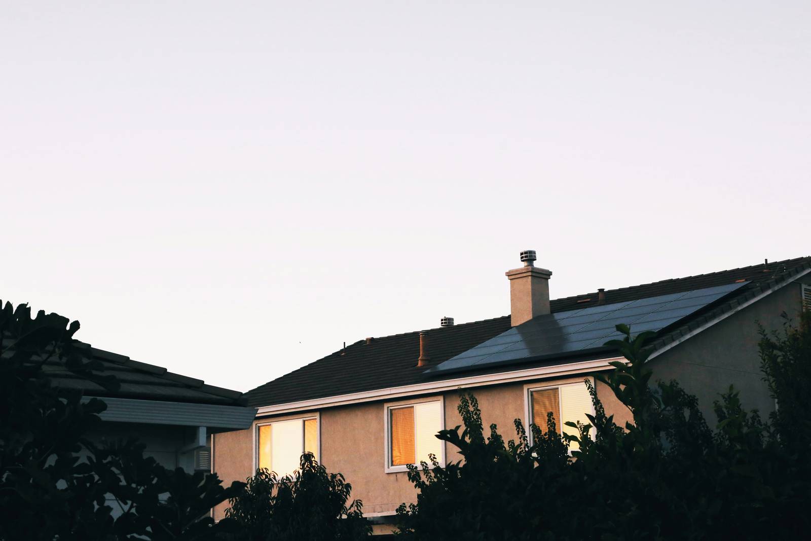 Panels on the roof of a home at dusk